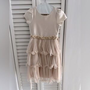 Gorgeous girls’ champagne dress with ruffled tulle skirt and beaded waist